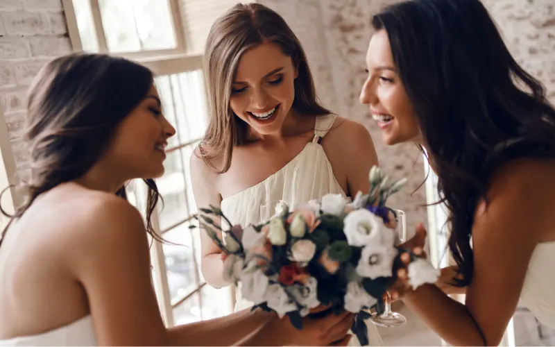 Mallorca wedding florist arranging a stunning bridal bouquet with Mediterranean blooms and greenery